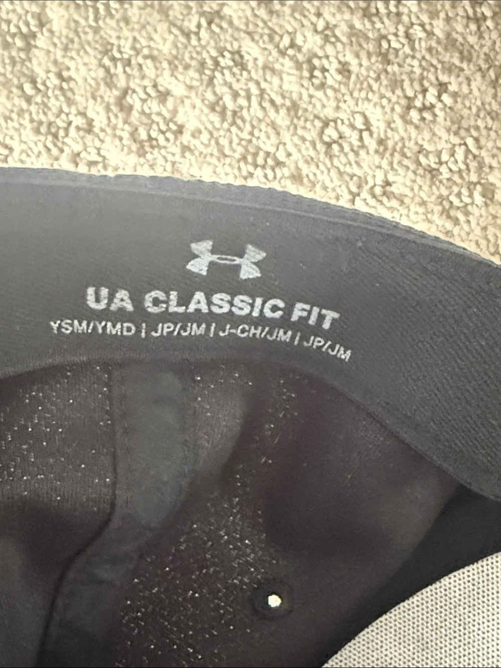 Under Armour youth black hat size small / medium with embroidered logo